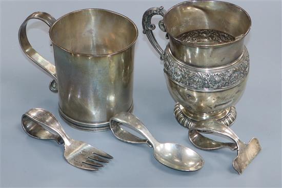 Two Tiffany & Co sterling mugs including a reproduction original by John Diand a Tiffany & Co sterling spoon, pusher and fork set,